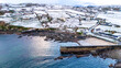 Aerial view of a snow covered Portnoo harbour in County Donegal, Ireland.