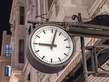 Fototapeta  - Large Public Clock Hanging Over Street in Istanbul Turkey