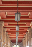 Fototapeta Sawanna - Glass Lanterns in Row at Hallway With Red Ceiling Sofia