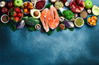 Healthy food background. Concept of Healthy Food, Fresh Vegetables, fish, Nuts and Fruits. On a concrete background. Top view. Copy space