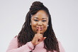African woman, finger on lips and portrait in studio for secret news, privacy and gossip for confidential. Young people, hush gesture and emoji or sign for silent, quiet or warning for mysterious