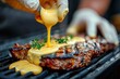 Chef preparing grilled steak in creamy lemon butter or cajun spicy sauce with herbs