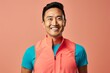 Portrait of a grinning asian man in his 30s wearing a lightweight running vest in pastel or soft colors background