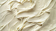 A detailed top-view photograph captures the luscious texture and richness of cream, highlighting its intricate details. This close-up image invites viewers to appreciate the smoothness and indulgence 