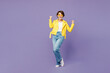 © ViDi Studio - Full body young woman wear yellow shirt white t-shirt casual clothes glasses doing winner gesture celebrate clenching fists say yes isolated on plain pastel light purple background. Lifestyle concept