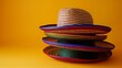stack of straw striped sombreros