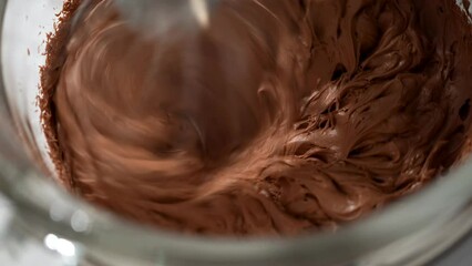 Canvas Print - Whipping chocolate ganache with an electric kitchen mixer.