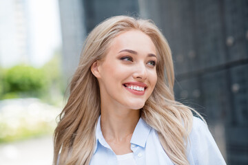 Sticker - Portrait of positive pretty cute youngster girl blonde in big city walk alone summer outside