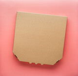 Fototapeta Mapy - Pizza closed carton box on uniform pink background flat lay mockup with copyspace