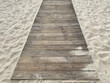 Wooden pier lying on a sandy beach
