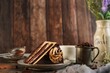 Slice of homemade Chocolate coffee crunch cake on dark wooden background, selective focus