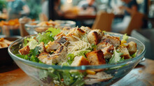 A Bowl Of Chicken Salad With Croutons
