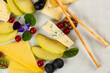 Cheese platter. Cheese appetiser dish. Close up photo with a delicious plate made with different type of cheese like gouda, brie, camembert and other French cheese.