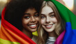 An image of two girls: both wrapped in an LGBT flag. They stand close, one girl resting her head on the other's shoulder. The image captured a moment of serene happiness.