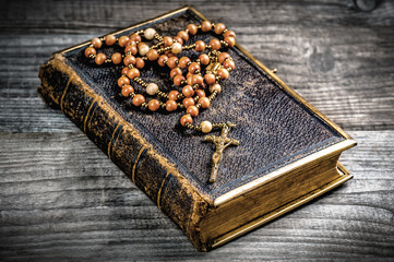 Wall Mural - Vintage rosary beads on old Bible