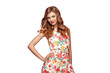 Blonde young woman in floral spring summer dress. Girl posing on a transparent background. Summer floral outfit. Fashion photo. Blonde lady