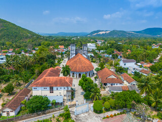 Wall Mural - Aerial view of Mang Lang Catholic Church in ancient village in Phu Yen province, Vietnam. Travel and landscape concept