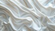 Smooth and luxurious white satin fabric, gently undulating with an elegant, timeless grace
