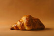 A freshly baked croissant, buttery and flaky, isolated on a café au lait brown background, invoking a Parisian morning