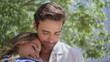 © stockbusters - Lovely pair embracing together feeling happy at garden closeup. Romantic couple