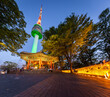 Panorama Seoul city at Night and Namsan Tower or N Seoul Tower stands tall on the top of Namsan Mountain, South Korea.