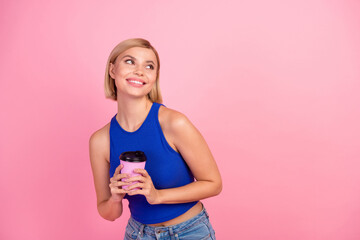 Sticker - Photo of pretty young woman hold coffee look empty space wear blue top isolated on pink color background