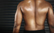 © peopleimages.com - Rear view, person and back for muscular, fitness and physical strength for workout and bodybuilding. Body, exercise and skin for wellness or ripped for health, gym or active for closeup on mockup