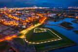Fototapeta Konie - Bison bastion, 17th-century fortifications of Gdańsk illuminated at night. Poland
