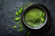 © KN Studio - Green matcha tea in bowl pure black background vibrant color minimal styling top view
