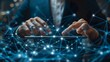 © Raihan - Businessman using a tablet and touching a digital connection network on a dark blue background, a close up of a hand holding a tablet with global connections or data transfer technology concept