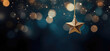 © Sascha - A twinkling gold star ornament dangles elegantly against a soft-focus, starry bokeh background in shades of deep blue, symbolizing the joy of the holiday season.