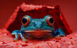 A frog with red eyes is sitting in a red leaf. The frog is looking at the camera