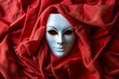A lone white mask with a crimson silk backdrop, invoking a sense of mystery and elegance for theater enthusiasts