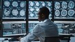Medical professional analyzing brain scans on multiple monitors in a dark control room.