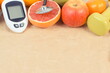 Glucometer for checking sugar level and fresh ripe fruits. Healthy lifestyle. Source minerals and vitamins. Place for text