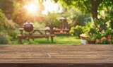 Fototapeta  - summer time party in backyard garden with grill BBQ, wooden table, blurred background