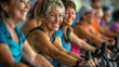 Enthusiastic participants pedal away in an indoor cycling class