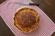 savoury quiche pie on vintage checkered cloth