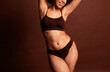 Cropped photo of pretty cute lady underwear lingerie accepting stretching marks skin isolated brown color background