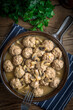 Delicious homemade swedish meatballs with mushroom cream sauce. Small depth of field. Top view.
