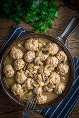 Sticker - Delicious homemade swedish meatballs with mushroom cream sauce. Small depth of field. Top view.