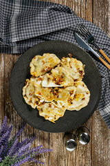 Canvas Print - Fried dumplings (pierogi) with spinach.