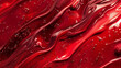 Red lacquered shiny glossy surface. Abstract background with stains and drops. Background for design with cosmetics.
