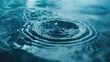 Detailed close-up of a single water drop in a pool, perfect for illustrating purity and freshness
