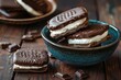 Indulge in the Creamy Cold Delight of Ice Cream Sandwiches on a Rustic Wooden Background. Closeup of Dark Brown Chocolate with a Bowl in Blue Hue