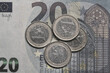 Euro banknotes and euro coins colorless