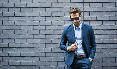 Wall Mural - Stylish, male person and lawyer in suit with mockup space for fashion, style and trendy in outdoor. Man, pride and confidence in street for work, corporate or career in law firm in grey background