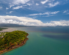 Aerial View Of Clear Blue Ocean And Tropical Coastline, Port Douglas, Queensland, Australia.