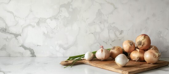 Wall Mural - White modern kitchen counter with fresh onions. Room for text.