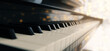 Piano keyboard close up view with selective focus. Warm color toned